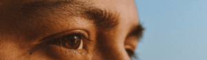 Close up image of a man's eyes as he is observing.